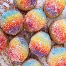 Rainbow colored mini mimosa bomb pastries from Firecakes donuts