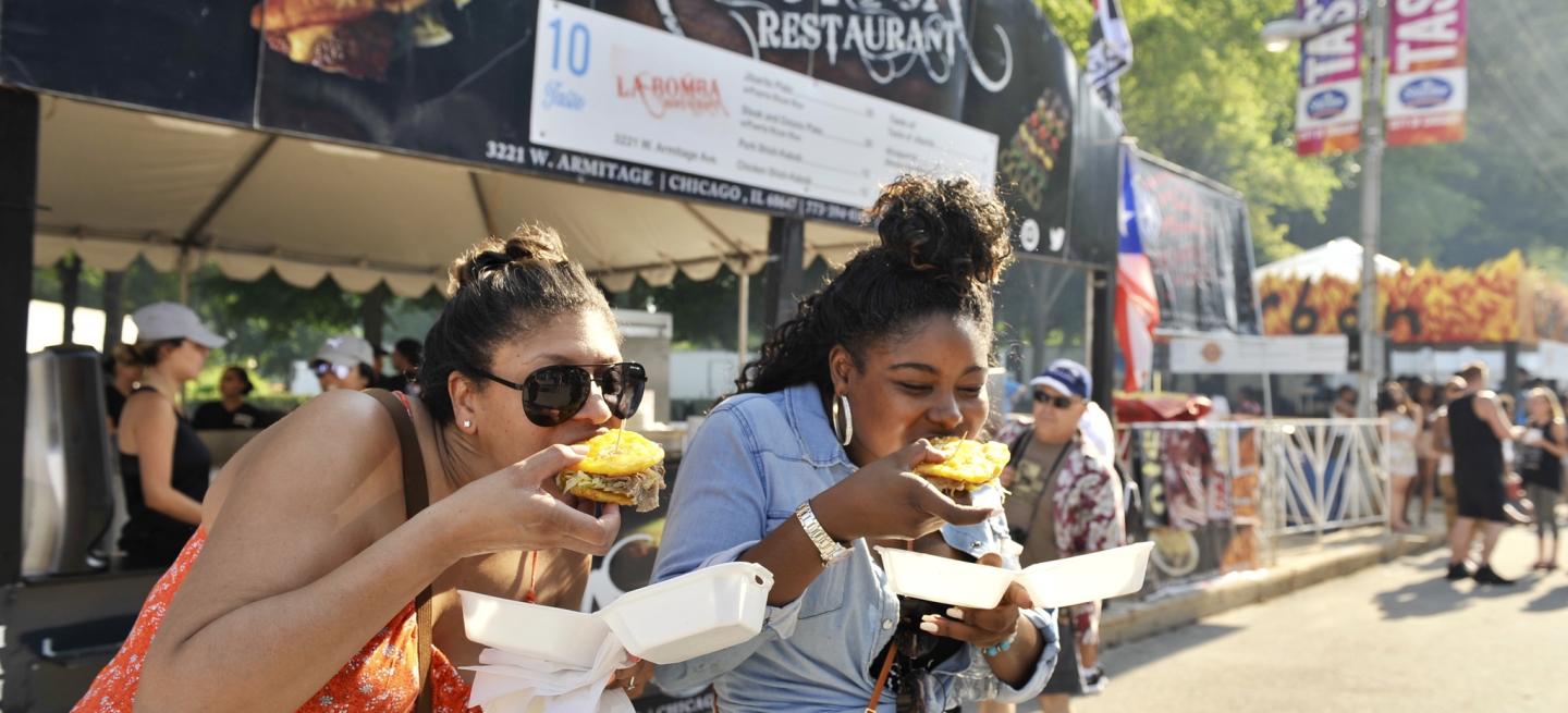 two women eating at Taste of Chicago