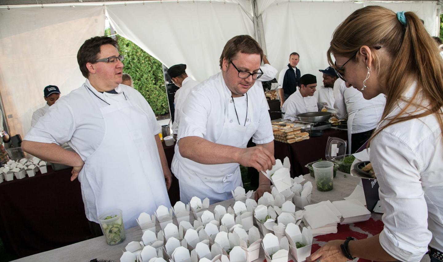two chefs at Chicago Gourmet serving food